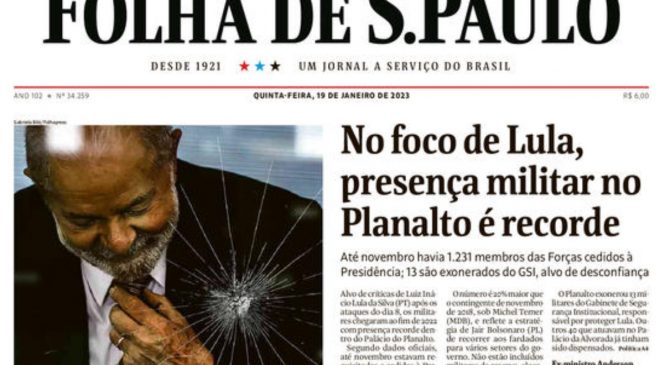 Capa da Folha de S. Paulo; Lula com mão no peito, vidro estilhaçado e militares e “foco” na manchete